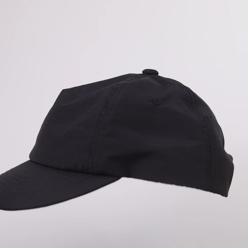 Side profile of a short-brim low-profile cap on a head form