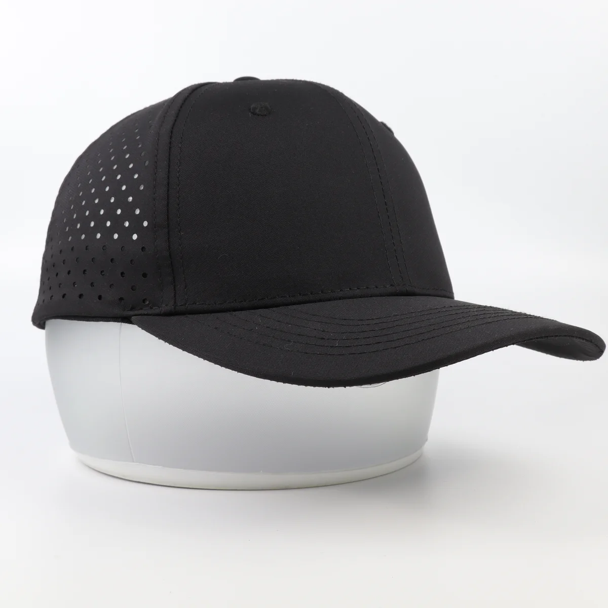 Black curved-brim cap with plain solid front panels and perforated side crown