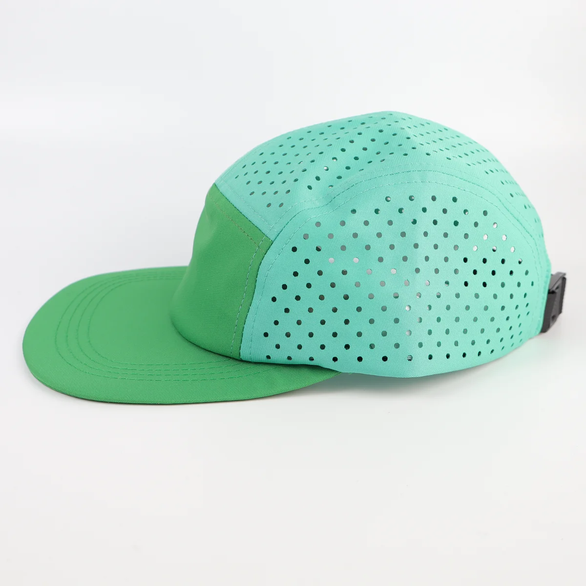 Side of the mint green five-panel style cap showing perforated upper and rear panels