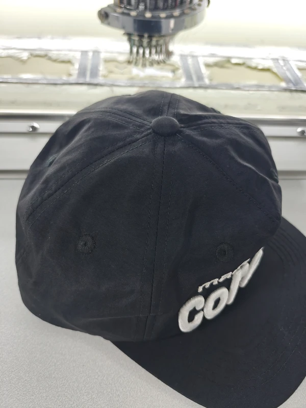 Top of black cap showing crown seam placement