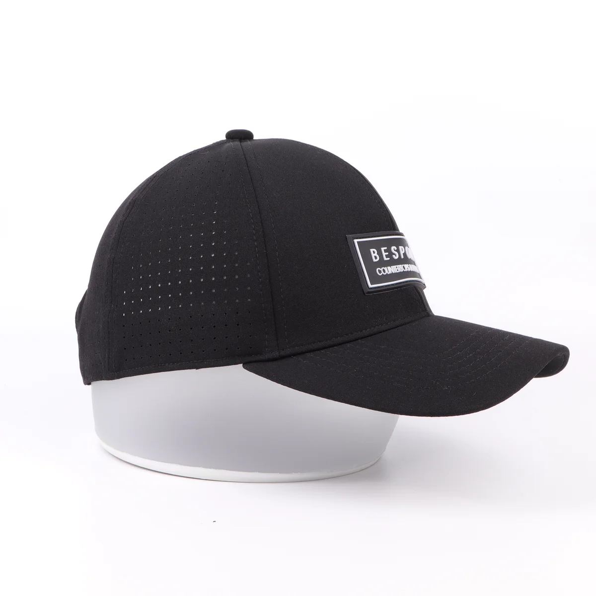Black perforated cap showing side-panel ventilation