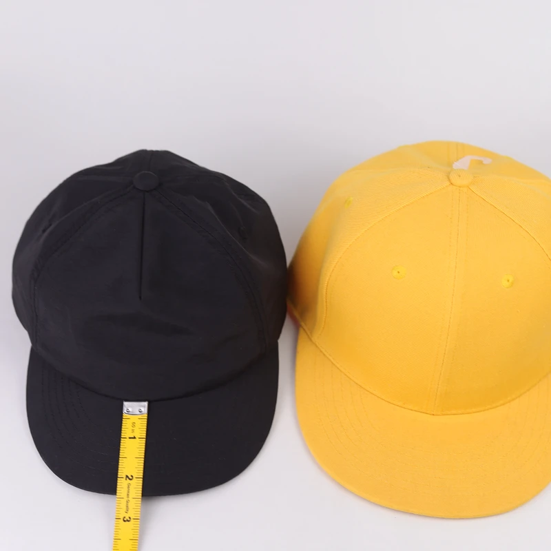 Tape measurement placed on a short cap visor