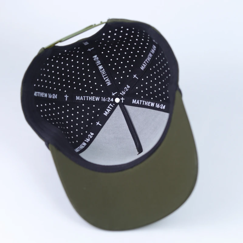 Interior of olive performance cap showing perforated black lining and seam tape