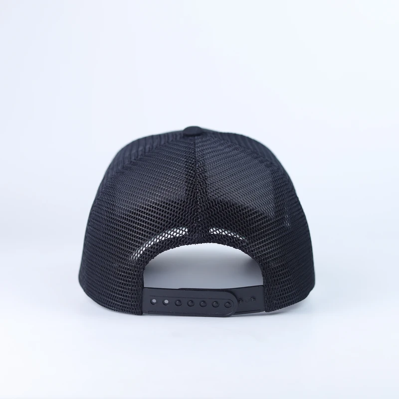 Back of a black mesh trucker cap showing the adjustable black plastic snap closure