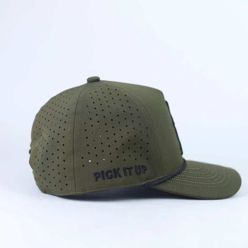 Side view of an olive green cap showing many small perforations across the crown and black side embroidery